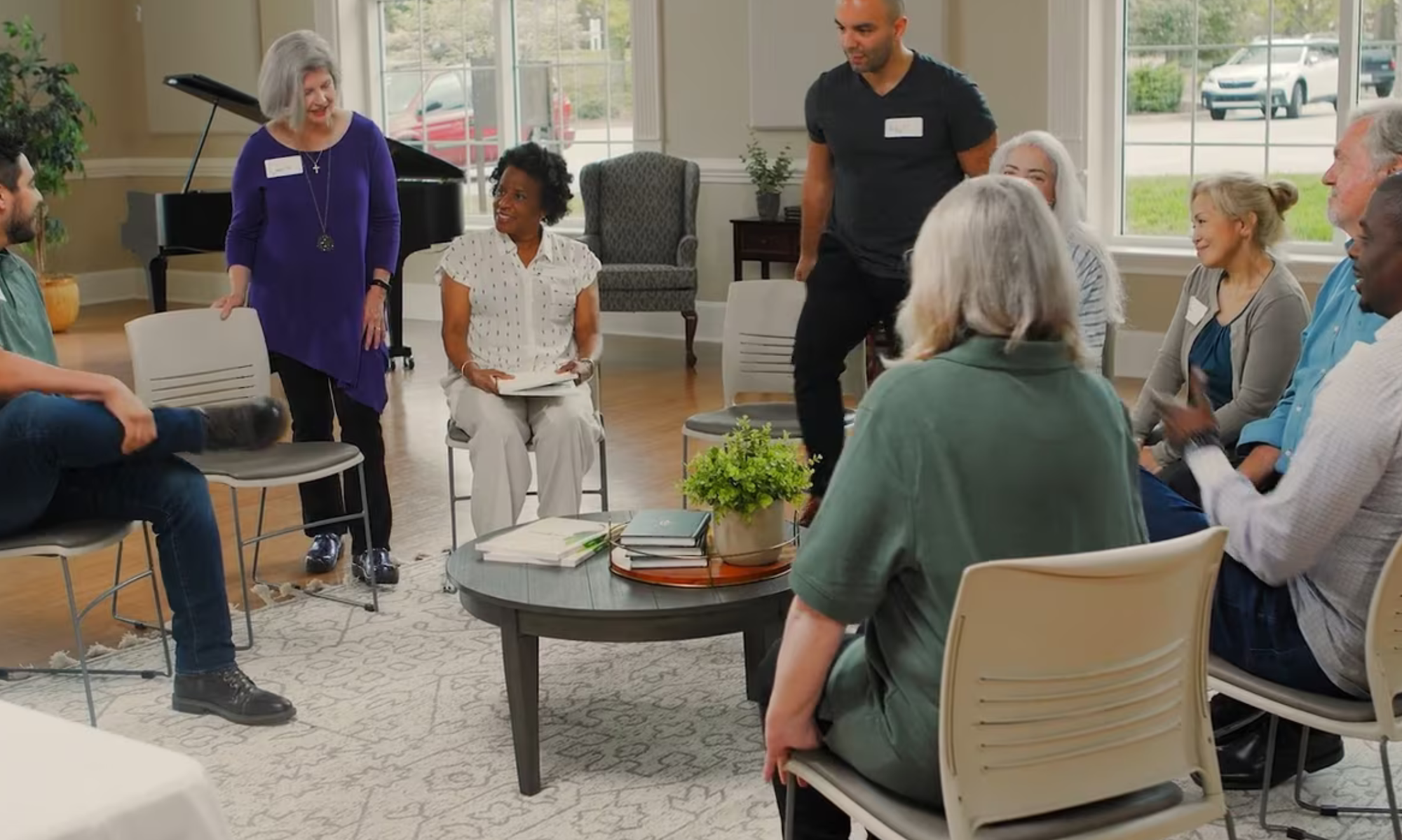 Photo of a group of people meeting together.